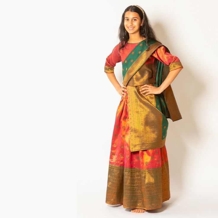 Introducing "Thanvi" - a celebration of elegance and tradition for your little one. This Girls Pattu half saree is crafted from luxurious art silk, featuring a stunning rust lehenga that exudes warmth and sophistication. The ensemble is elevated with a dark green dupatta, adding a rich and regal touch to the outfit. Perfect for special occasions or festive celebrations, Thanvi captivates hearts with its timeless beauty and graceful charm. Please Note: Color of the actual product may vary slightl Dark Green Dupatta, Rust Lehenga, Pattu Half Saree, Green Dupatta, Luxury Art, Rust Orange, The Outfit, Half Saree, Girls Shopping