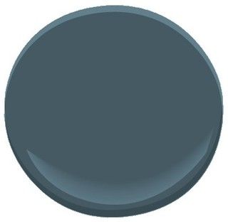 a dark blue paint color is shown in this round image with the top half painted