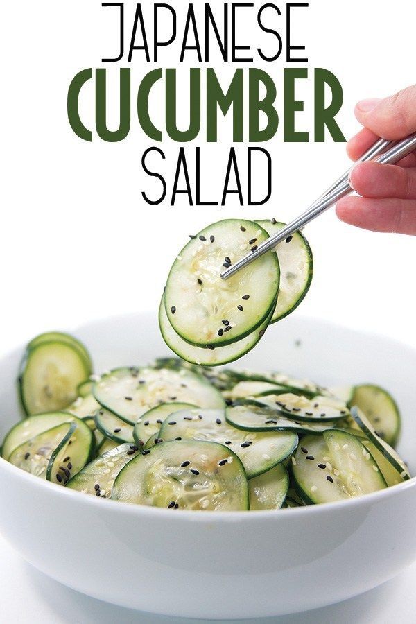 someone is spooning cucumber slices into a bowl with the words japanese cucumber salad