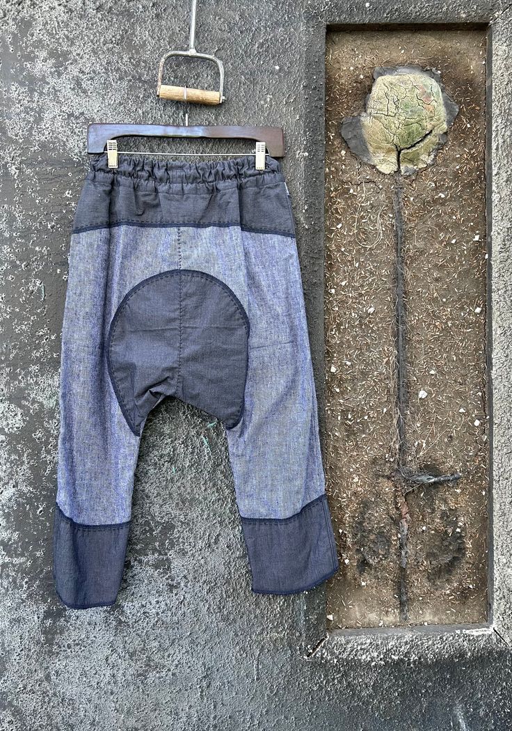 Relaxed Fit Denim Blue Patchwork Bottoms, Baggy Cotton Patchwork Jeans, Baggy Patchwork Cotton Jeans, Baggy Indigo Cotton Bottoms, Blue Deconstructed Cotton Jeans, Bohemian Style Denim Blue Cotton Pants, Relaxed Fit Denim Blue Patchwork Pants, Bohemian Denim Blue Cotton Pants, Denim Blue Cotton Patchwork Bottoms