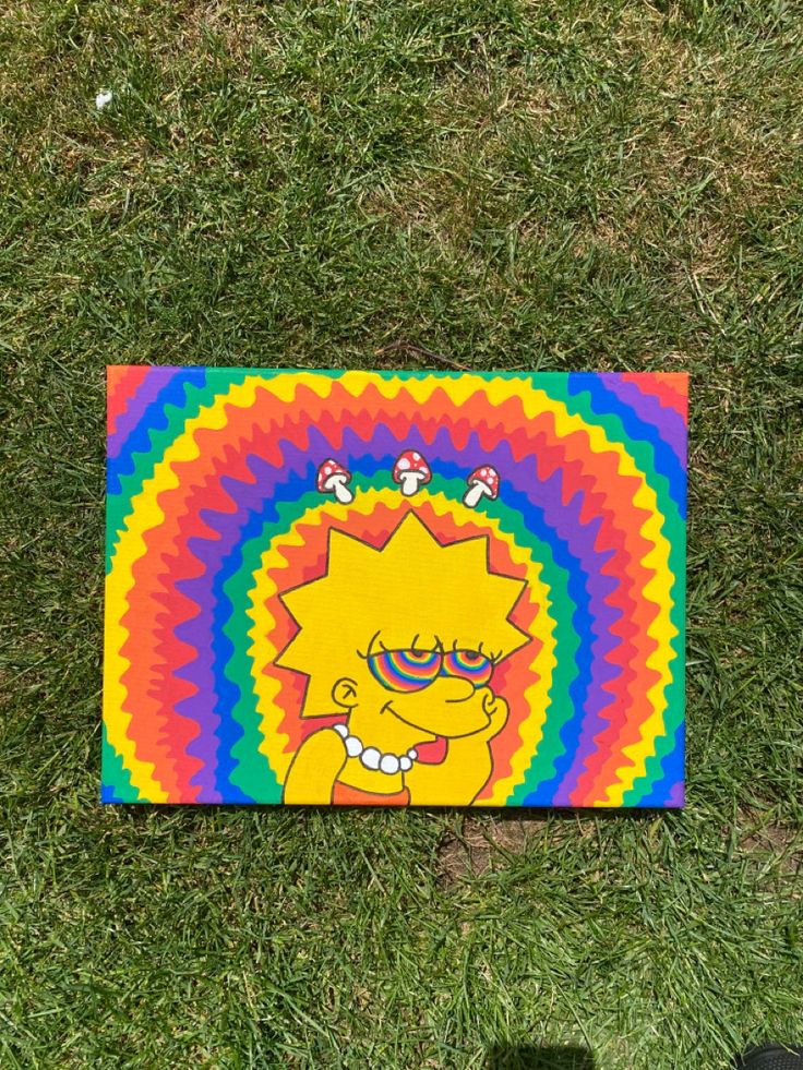 a painting on the grass that looks like simpsons with glasses and tie - dyed hair