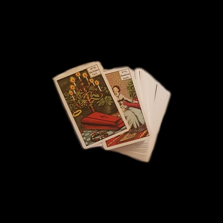 three tarot cards sitting on top of each other