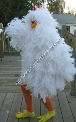 a chicken costume is standing on a wooden deck