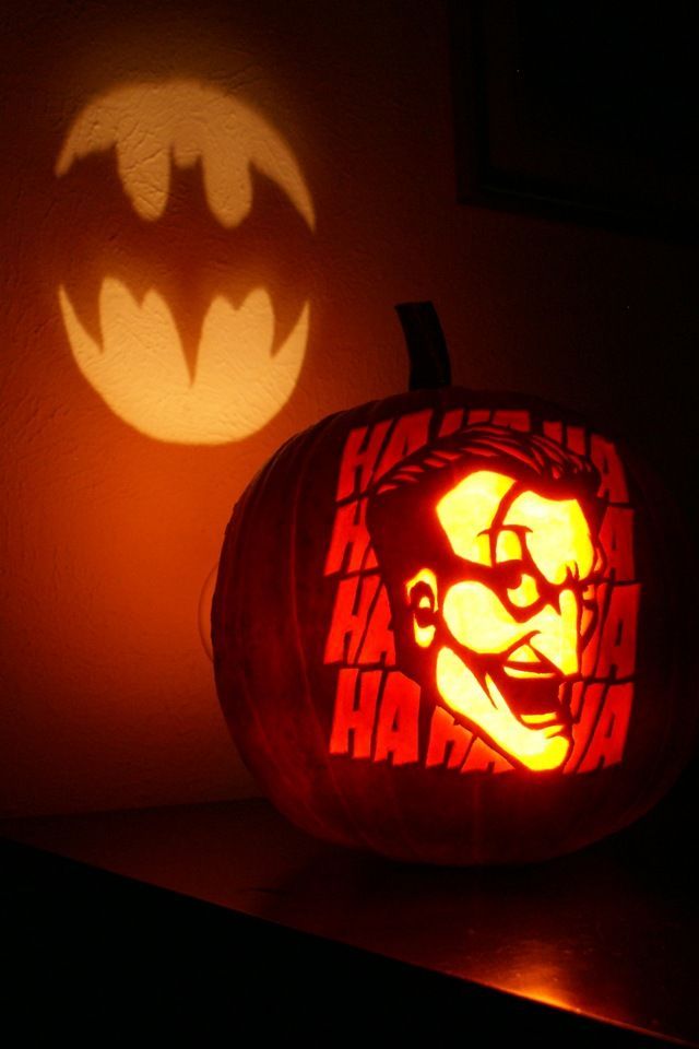 a carved pumpkin with the face of batman on it