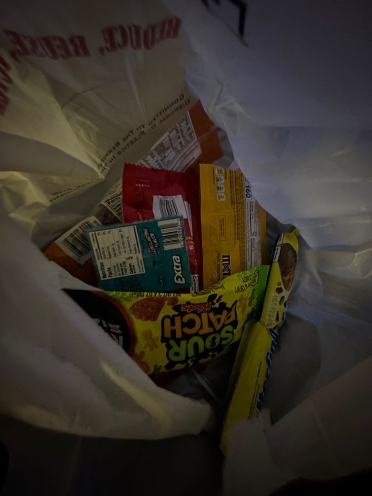 a bag full of snacks sitting on top of a table