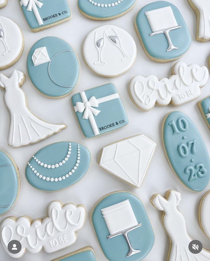 blue and white cookies decorated with wedding decorations