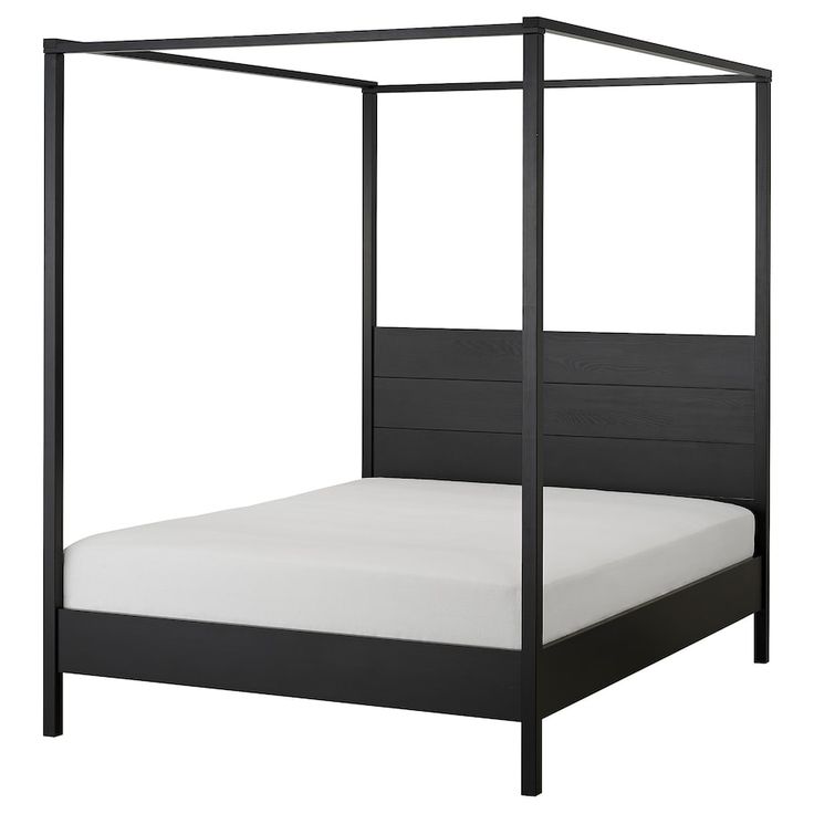 a black bed frame with white sheets and pillows on the bottom side, in front of a white background