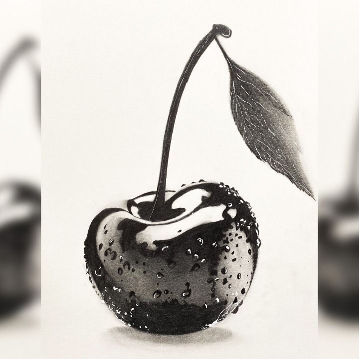 a black and white photo of an apple with water drops