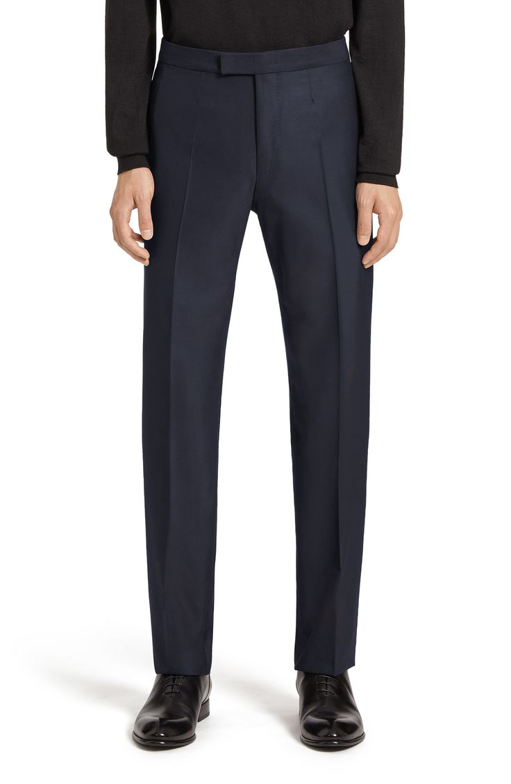 A sumptuous choice for formal wear, this classically styled navy tuxedo is impeccably tailored in Italy from a blend of superfine wool and lustrous silk. Jacket has one-button closure; peaked lapels; chest pocket; welt pockets

 Trousers have zip fly with hook-and-bar closure

 Jacket is lined; trousers are lined to the knee 85% wool, 15% silk Dry clean Made in Italy Men's Designer Clothing Elegant Tailored Navy Tuxedo, Classic Slim Fit Tuxedo With Welt Pockets, Classic Slim Fit Tuxedo With Pressed Crease, Luxury Slim Fit Tuxedo For Semi-formal Occasions, Luxury Slim Fit Suits With Pressed Crease, Luxury Fitted Tuxedo With Concealed Placket, Luxury Wool Tuxedo, Luxury Tailored Tuxedo In Suiting Fabric, Luxury Slim Fit Suit For Black-tie Events