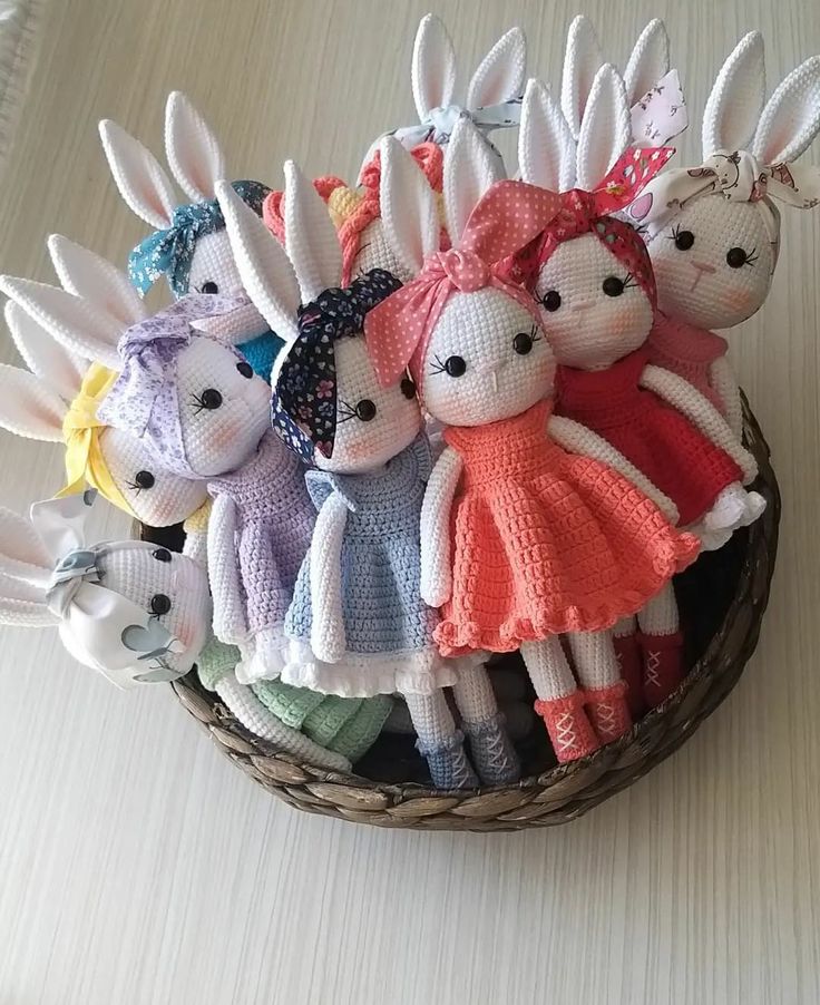 a basket filled with stuffed animals sitting on top of a table