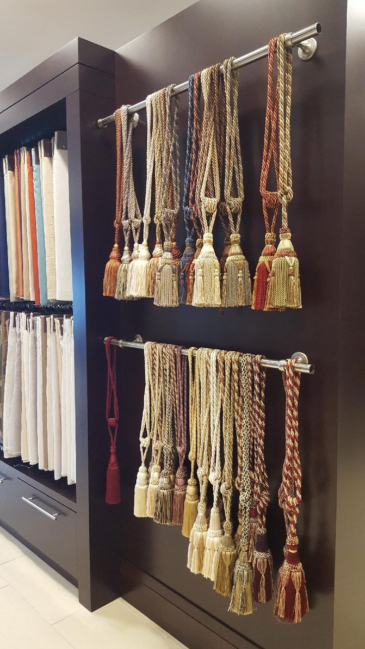 the wall is filled with different types of tassels