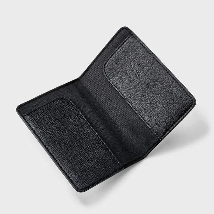 Keep your passports in one convenient place with this Passport Case from A New Day™. This passport case is designed with two slots to let you store two passports. Made of 100% recycled polyester, this passport case features a bifold design for easy carrying. A New Day™: Style that goes wherever you do. Black Travel Accessories With Card Slots, Black Rfid Blocking Travel Case, Functional Bifold Card Holder For Travel, Black Rfid Blocking Business Travel Accessories, Black Trifold Wallet With Card Slots For Travel, Black Travel Accessories With Interior Card Slots, Functional Black Card Holder For Daily Use, Black Travel Accessories With Card Slots For Daily Use, Accordion Cards