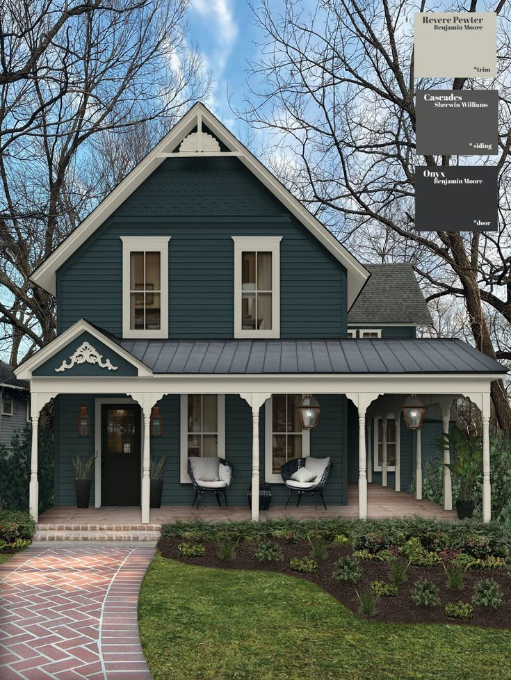 a house with blue siding and white trim on the front porch, along with brick walkway