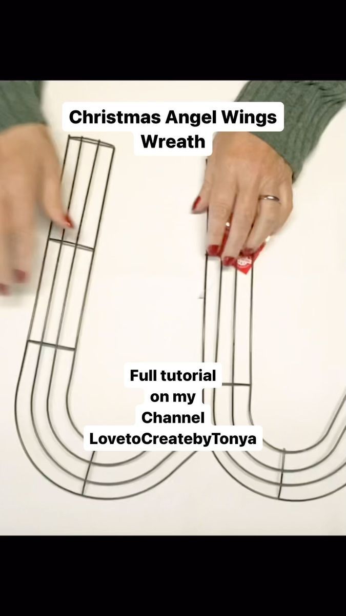 a woman is making a christmas angel wings wreath with wire on the top and bottom