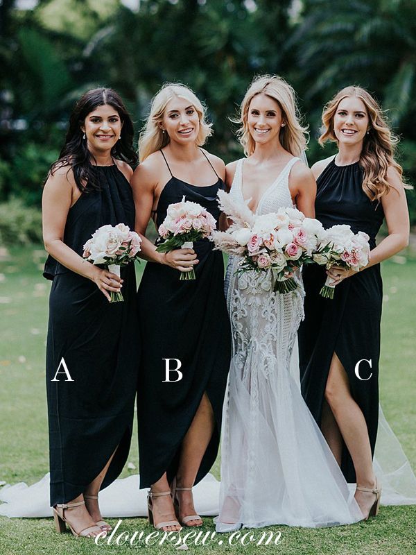 four bridesmaids in black dresses posing for the camera