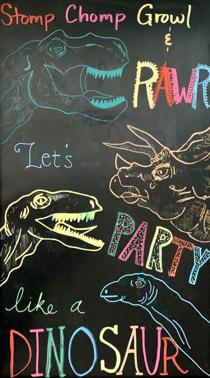 a chalkboard with different types of dinosaurs on it