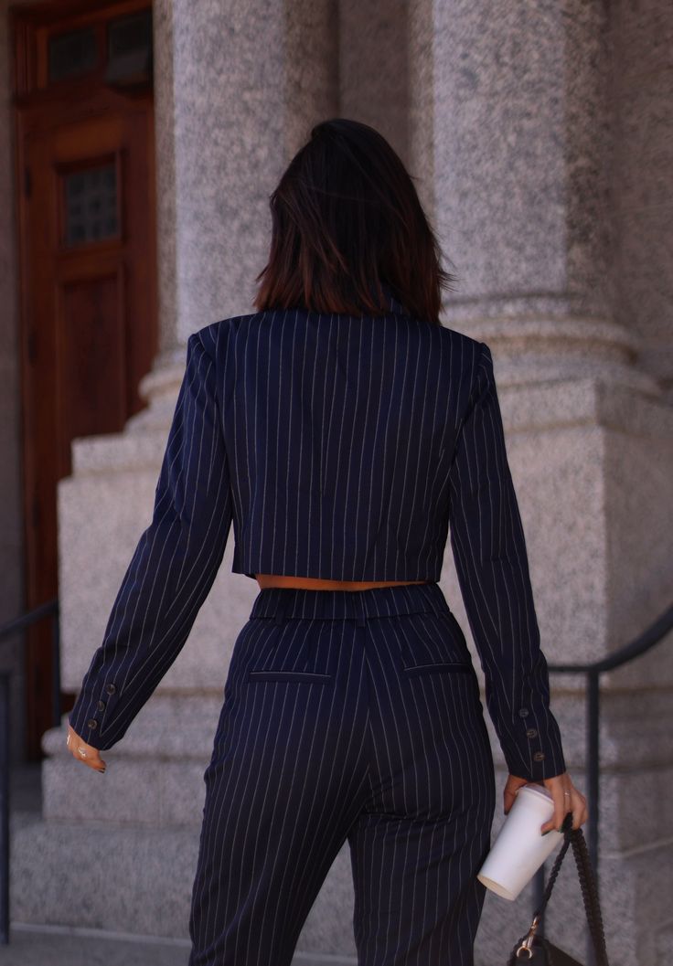 Our Navy Pinstripe Cropped Blazer is perfect for adding a touch of style to any outfit. With its pinstripe design, cropped fit, and blazer collar, this top is both chic and versatile. Pair it with high-waisted pants or a skirt for a sleek and professional look. Fabric 65% polyester, 32% rayon, 3% spandex Lining 100% polyester Blazer Collar, Pinstriping Designs, Cropped Blazer, A Skirt, Professional Look, High Waisted Pants, Sleek, High Waisted, Spandex