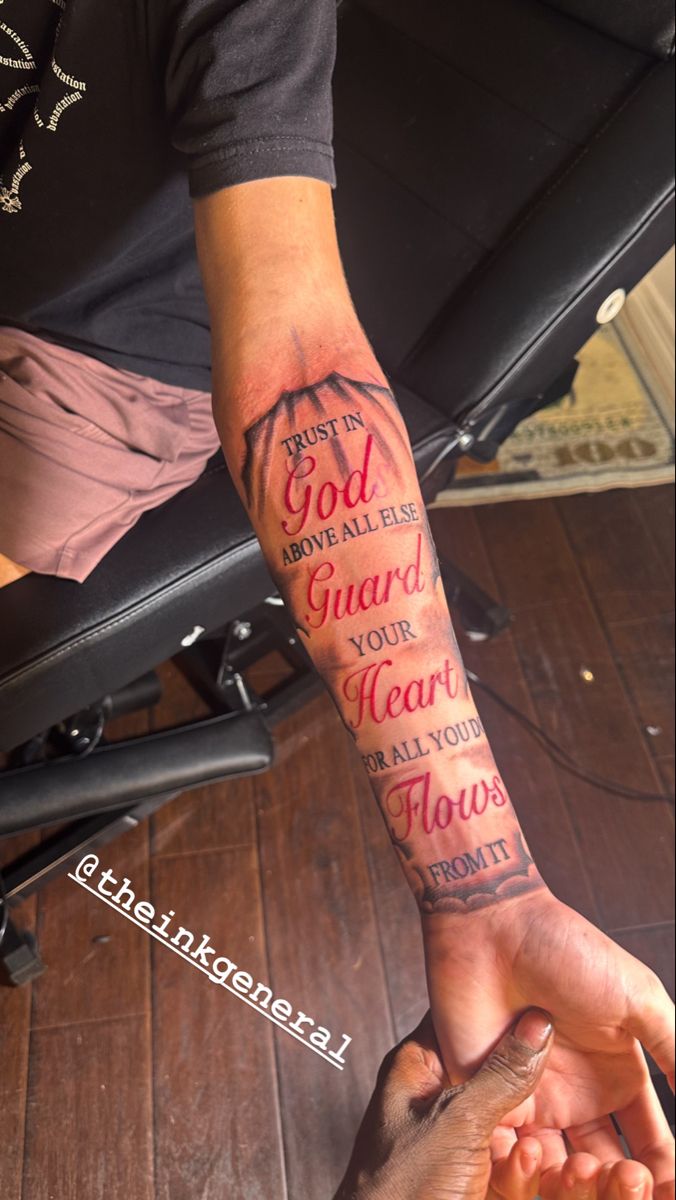 two hands holding each other with the words god and guard your heart above them on their arm