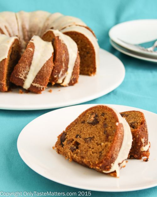 two white plates with slices of cake on them and one slice has been cut from it