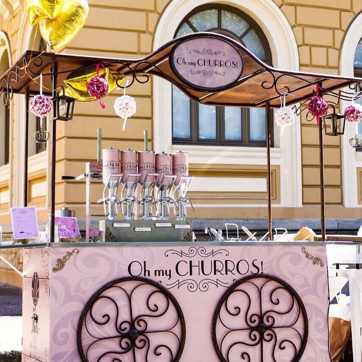 an ice cream cart with pink and purple decorations