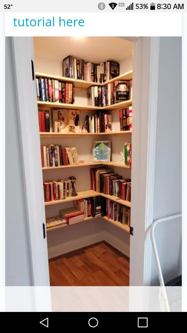 an open book shelf with many books on it