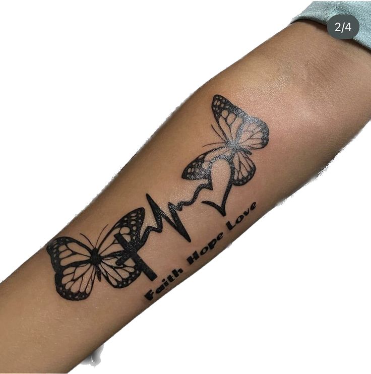 a woman's arm with butterflies on it and the word love written in black ink