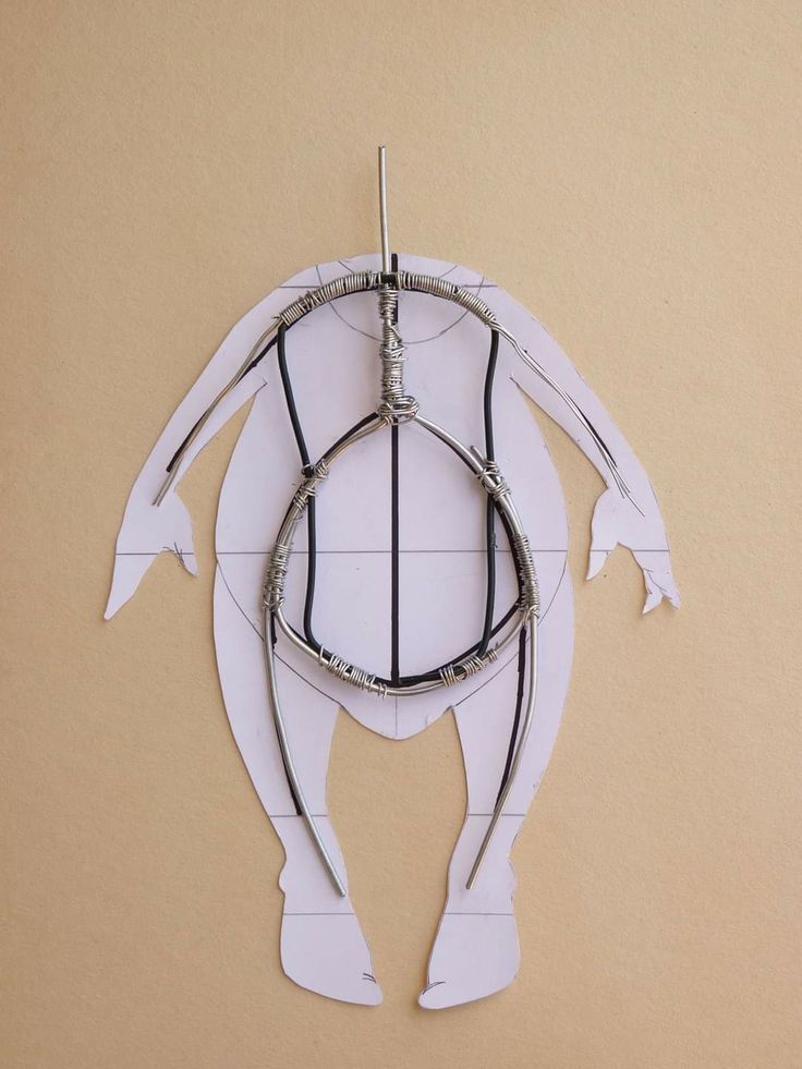 a paper cut out of a woman's torso with black and white lines on it