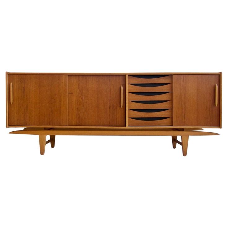 the sideboard is made out of wood and has black lines on the front panel