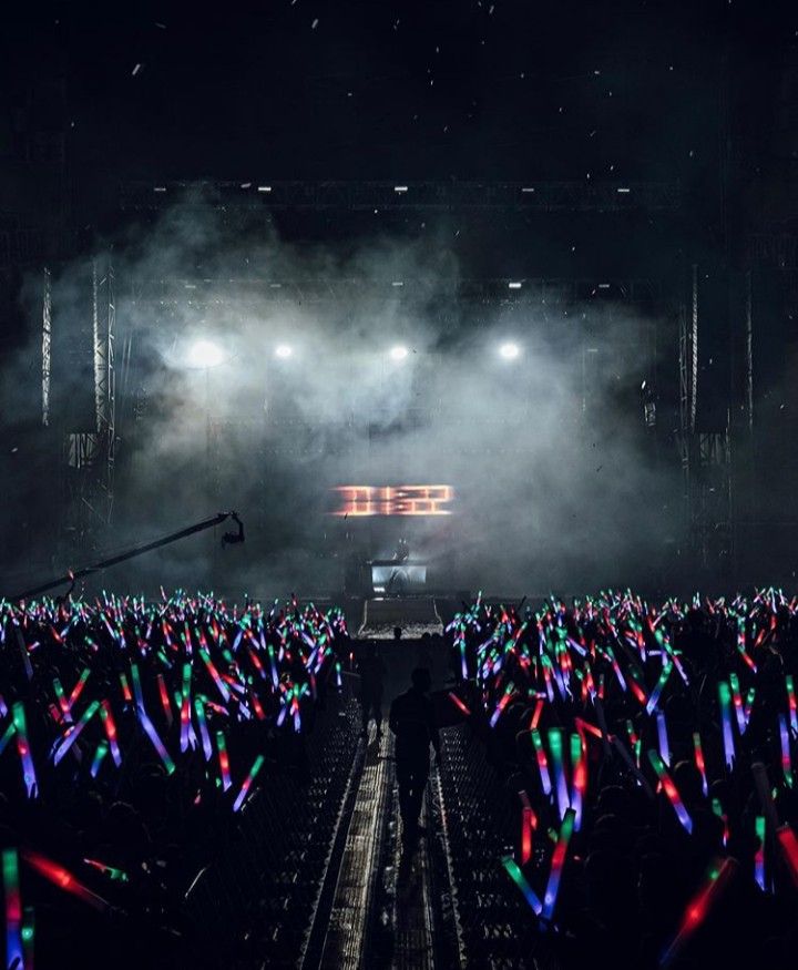 the stage is lit up with colorful lights