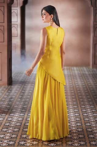 Yellow short kurta with an asymmetric hem cut, tonal bird and floral pattern embroidery, highlighted with pearl work. Comes with embroidered dupatta and a plain sharara. - Aza Fashions Designer Sleeveless Raw Silk Kurta, Designer Sleeveless Dress With Cutdana Detailing, Designer Sleeveless Dresses With Cutdana, Sleeveless Designer Dresses With Cutdana, Sleeveless Raw Silk Sets For Eid, Traditional Sleeveless Chanderi Sharara, Sleeveless Chanderi Palazzo Set For Diwali, Sleeveless Kurta For Wedding And Navratri, Traditional Navratri Peplum Dresses