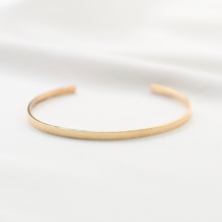 "14K gold cuff bracelet. 14K Gold Minimalist Cuff Bracelet * 14K solid gold. It is about 3mm x 1mm Please select the size of your wrist. If your wrist is 6\", please purchase 6\" bracelet. (If you order a 6\" bracelet, actual cuff length will be 5\" plus 1 inch opening.) Please read our policies before you place your order. https://www.etsy.com/shop/SashJewelry/policy?ref=shopinfo_policies_leftnav To see other Mother daughter necklace set click here: https://www.etsy.com/shop/SashJewelry?section 14k Gold Polished Minimalist Cuff Bracelet, Minimalist 14k Gold Cuff Bracelet With Polished Finish, Adjustable Minimalist Gold Bracelet With Polished Finish, Adjustable Yellow Gold Minimalist Cuff Bracelet, Minimalist Adjustable Yellow Gold Cuff Bracelet, Minimalist Yellow Gold Cuff Bracelet For Formal Occasions, Minimalist Polished Cuff Bracelet For Wedding, Minimalist Wedding Cuff Bracelet With Polished Finish, Minimalist Yellow Gold Cuff Bracelet For Everyday