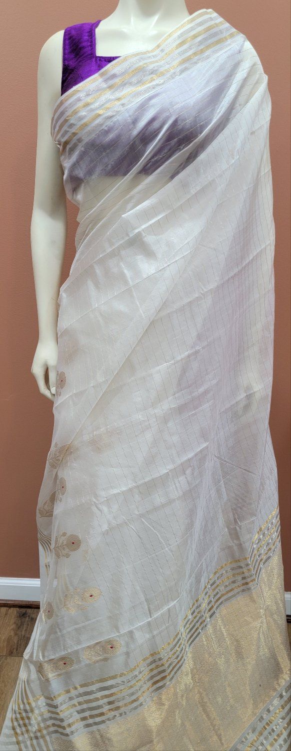 Exclusive Chanderi Pattu Silk Saree Collection w/ custom Blouse. For Custom Blouse Pls contact us. Free Shipping within the US. Saree ships immediately within the US and the Blouse 2 weeks later. Custom blouse stitching $25. White Anarkali Blouse With Sheer Dupatta, Designer White Blouse With Sheer Dupatta, White Cotton Silk Pre-draped Saree With Zari Work, White Blouse With Sheer Dupatta In Traditional Drape, White Blouse With Sheer Dupatta For Diwali, White Cotton Silk Pre-draped Saree For Festivals, Tussar Silk Pre-draped Saree For Traditional Ceremonies, White Silk Pre-draped Saree For Festivals, Fitted Chanderi Blouse With Sheer Dupatta