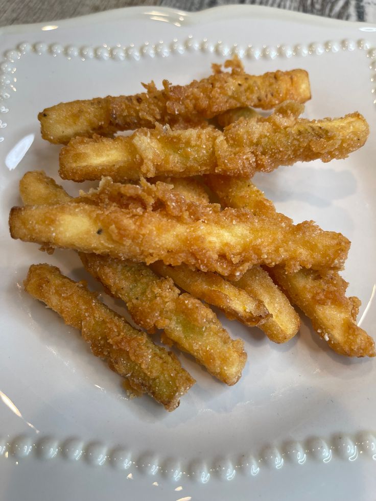 some fried food is on a white plate