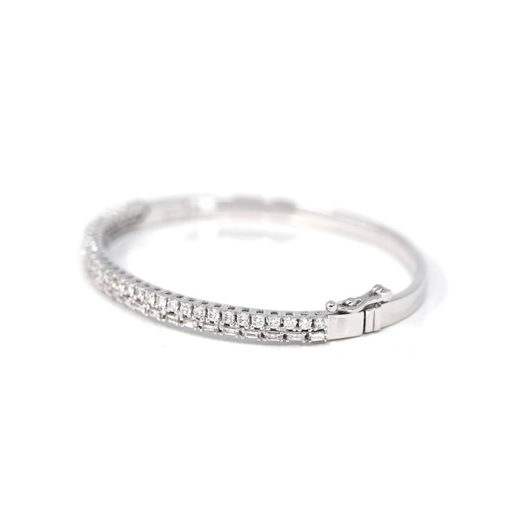 * Design Concept--- She'll love this tennis-look diamond Oval bangle bracelet so much she won't ever want to take it off. Crafted in 14K white gold, this hinged bangle gleams the way around & emerald with shimmering 1.64 ct diamonds in four-prong settings - all with a color rank of H and clarity of I1. Spectacular with 1.64 t.w. of diamonds and a bright polished shine, this sparkling bracelet measures 7.0 inches in circumference and secures with a tongue and groove clasp. * Specifications: approx. T Weight: 17.19 g Width: 4.5 mm Length: 7 inches Thickness: 3.5 mm Size: 50 mm *57.45 mm * 50 mm, 7 inches Material: 14k White Solid Gold Surface Finish: Polished Diamond: SI1 GH, 1.64 ct * IDEAL PRESENT: Order the gemstone ring for yourself or as a thoughtful present for a friend or loved one an Oval Bangle, Sparkle Bracelet, Jade Jewelry, Ring Fit, Unique Gemstones, Hinged Bangle, Design Concept, Oval Diamond, White Gold Diamonds