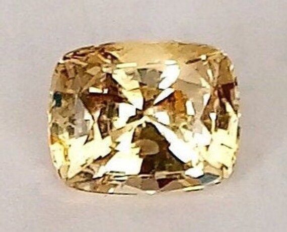 This Ceylon Yellow Sapphire is Untreated and Unheated. Sourced directly from the Local miners in Sri Lanka.  This rare cushion cut Yellow Sapphire has a beautiful natural colour and exceptional luster to it and most importantly has no treatments at all. An Unheated Yellow Sapphire from Sri Lanka well cut and polished.  The stone has not received any chemical treatments. NOT a lab created or a cultured stone. Gemstone - Natural Yellow Sapphire Weight - 1.55 Cts Measurement - 7.2×5.8×4.4mm Cut - Cushion Cut  Clarity - Eye clean to Loupe clean  Colour - Vivid Yellow  Luster - Full  Treatments - None/Untreated  Origin - Sri Lanka 100% Natural Gemstone.  This piece is excellent for a White Gold mounted Solitaire Ring or with Diamonds. Halo Yellow Sapphire diamond Ring.  Loose Gemstone for jewel Cultured Stone, Pink Spinel, Sapphire Diamond Ring, Red Fire, Yellow Sapphire, Sapphire Diamond, Cushion Cut, Custom Rings, Neon Pink