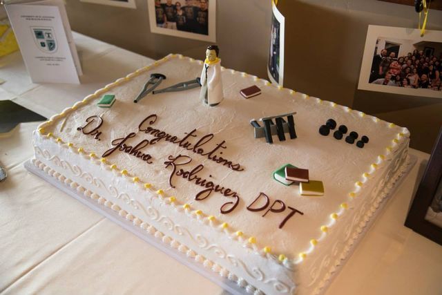 a white cake with writing on it sitting on a table