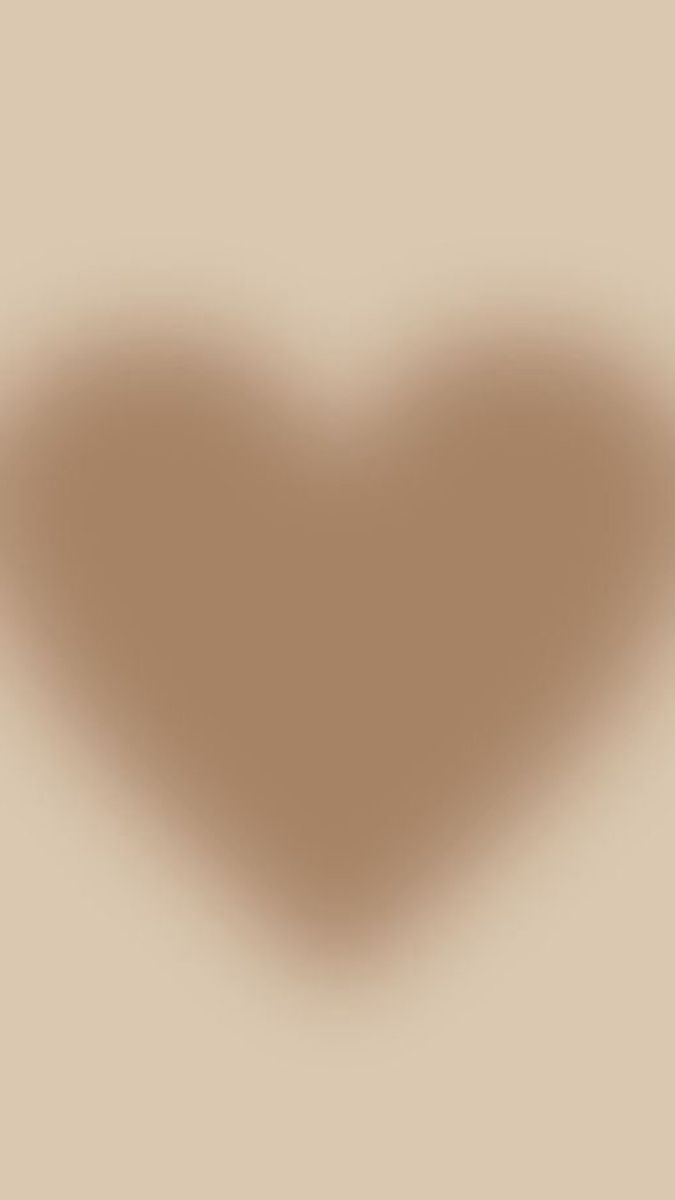 a heart shaped shadow on a beige background