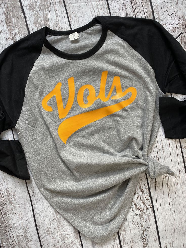 "The" Wallen Tennessee Vols Shirt #iykyk Morgan Wallen Tennessee Orange Shirt Heather Grey Graphic Print Top For Fans, Heather Grey Graphic Print Top For Fan Merchandise, Black Fall T-shirt For College, Gray T-shirt For College In Fall, Casual Heather Grey Fan Merchandise Tops, Gray Cotton Band Merch Tops, Black Tri-blend Tops With Letter Print, Gray Text Print T-shirt For Fall, Black Tri-blend Shirt For Streetwear