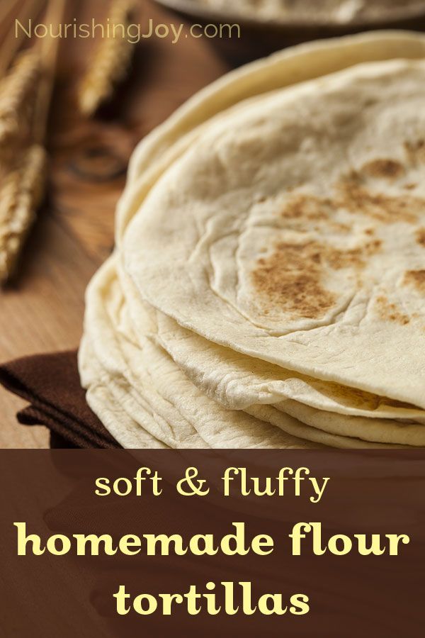 soft and fluffy homemade flour tortillas on a wooden table with text overlay