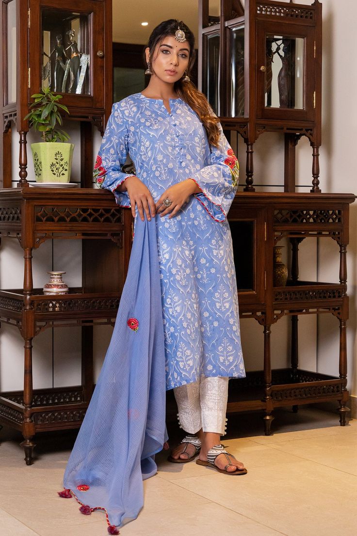 Sky blue cotton floral block print kurta. Paired with dyed embroidered worked dupatta and self print pant.
Component: 3
Pattern: Embroidered, Printed
Type Of Work: Magji lace, Block print
Neckline: Round notched
Sleeve Type: Flared sleeves
Fabric: Cotton, Doriya
Color: Blue
Other Details: 
Hand block prints
Doriya dupatta
Magji lace detail
Occasion: Work, Mehendi and Haldi - Aza Fashions Print Pant, Kurta Set For Women, Hand Block Print, Kurta Set, Printed Pants, Set For Women, Flared Sleeves, Aza Fashion, Fabric Cotton