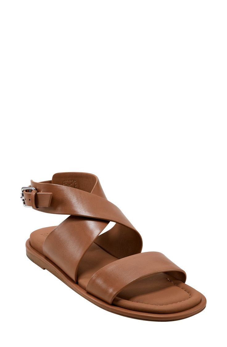 Wide leather straps amplify the contemporary appeal of a minimalist sandal set on a lightly cushioned footbed. Adjustable ankle strap with buckle closure; hidden elastic inset Cushioned footbed with arch support Leather upper and lining/synthetic and rubber sole Imported Modern Brown Sandals With Heel Strap, Modern Brown Sandals With Buckle Closure, Modern Brown Slingback Sandals With Ankle Strap, Modern Brown Ankle Strap Slingback Sandals, Modern Leather Sandals With Strap, Modern Double Strap Sandals, Spring Leather Single Strap Sandals, Modern Slingback Sandals With Ankle Strap, Spring Leather Sandals With Single Strap