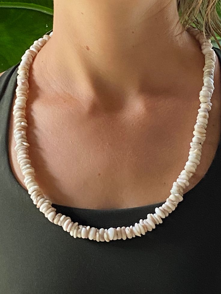 "This is a handmade,hand picked Hawaiian Puka shell necklace.The shells on this strand have been selected for size,uniformity and color(white).Subtle,petite and elegant in its simplicityIt was picked and strung by \"Uncle Whit\",a long time cultural practitioner and Rainbow Elder on one of his many beachcombing adventures here on our paradise island home,the Big Island of Hawai'i.We now bring this necklace to you,here on Etsy!Thanks for looking...Aloha!" Handmade White Pearl Shell Necklace, Handmade White Shell-shaped Pearl Necklace, White Shell-shaped Shell Necklace, Handmade White Shell Necklaces, White Shell Necklace With Pearl Charm, Elegant White Strand Shell, White Shell With Pearl Charm, Handmade White Shell Necklace, Handmade Pearl White Shell Necklace