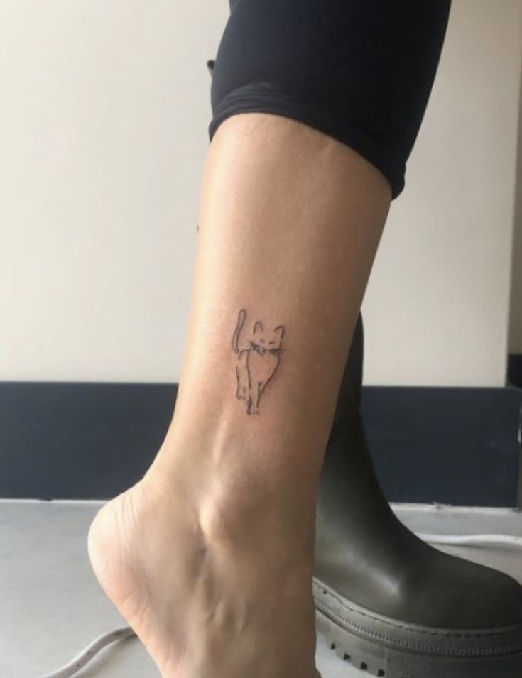 a person with a small tattoo on their foot