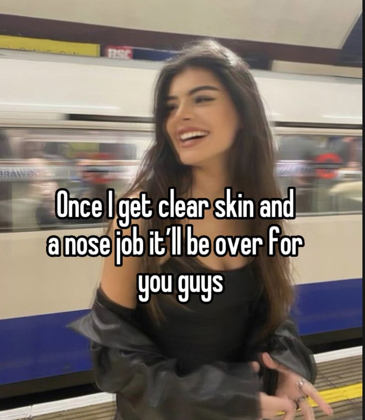 a woman standing in front of a train with the caption, once i get clear skin and a nose job it'll be over for you guys