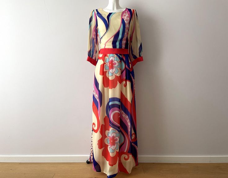 Vintage Bright maxi dress, psychedelic print chiffon women's gown, abstract flowers floor length maxi dress, gift idea for her, small Measurements: Shoulders: 15" Pit to pit - 17" Waist - 26.5" Sleeve - 18.5" Length - 58" Condition: very good condition  Please check measurements to insure a proper fit. Remember to allow yourself some extra room for movement. You can compare these with something from your closet that fits you well. Please convo me if you need additional measurements. SHIPPING * I Floral Print Floor-length Maxi Dress For Party, Floor-length Floral Maxi Dress For Party, Chic Flowy Maxi Dress With Vibrant Print, Flowy Long Floral Dress, Fitted Multicolor Floral Maxi Dress, Multicolor Printed Chiffon Maxi Dress, Summer Floral Print Maxi-length Gown, Elegant Abstract Print Maxi Dress For Spring, Elegant Maxi Dress With Abstract Print For Spring