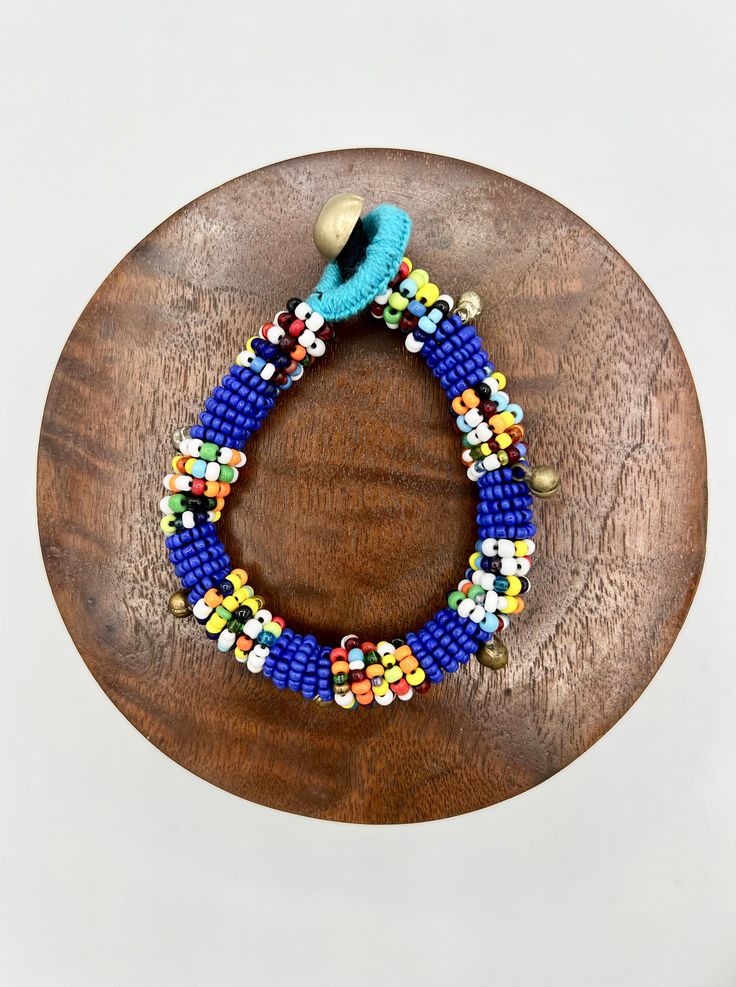 Colorful Bohemian Blue Stretch Bracelet With Colorful Beads, Blue Bohemian Stretch Bracelet With Colorful Beads, Blue Wooden Beaded Bracelets For Beach, Adjustable Blue Beaded Bracelets With Wooden Beads, Bohemian Blue Stretch Bracelet With Large Beads, Blue Wooden Beads For Festival, Adjustable Turquoise Beaded Bracelets With Wooden Beads, Blue Bohemian Beaded Bracelets With Wooden Beads, Bohemian Blue Beaded Bracelets With Wooden Beads