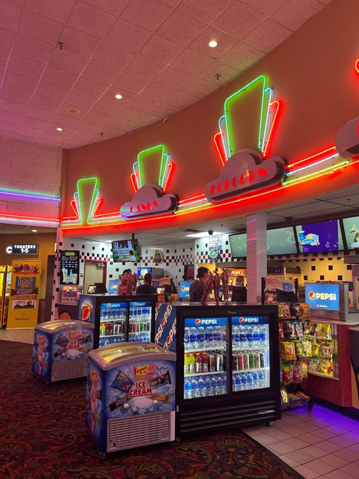 the inside of a restaurant with vending machines and neon signs