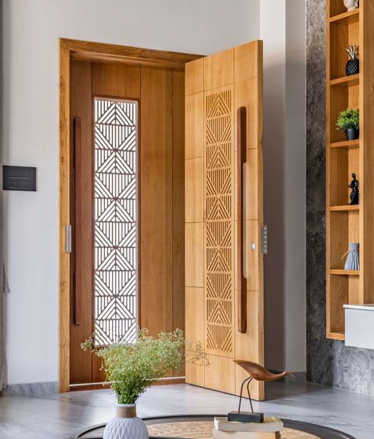 a living room filled with furniture and wooden shelves