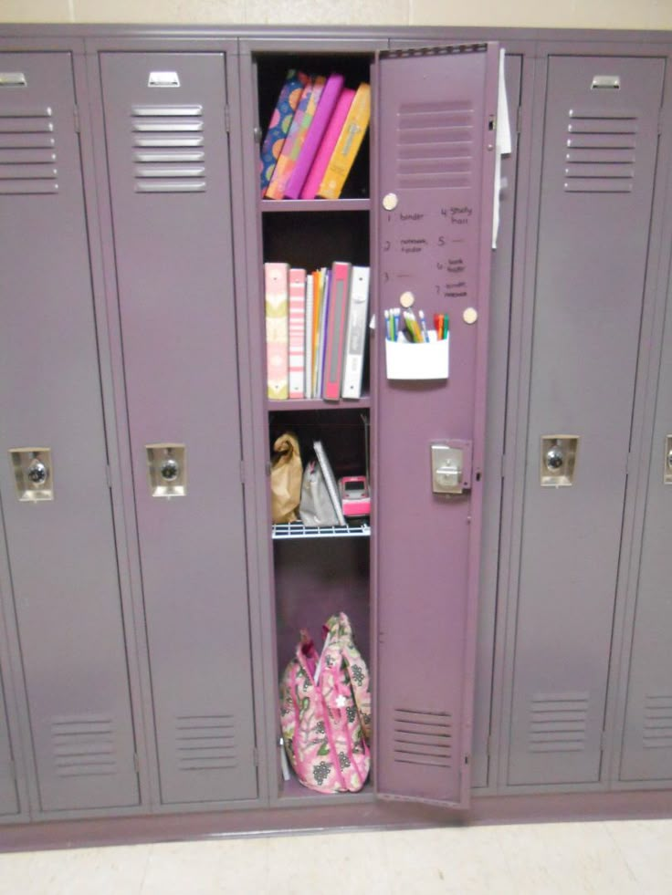 two purple lockers with books and school supplies