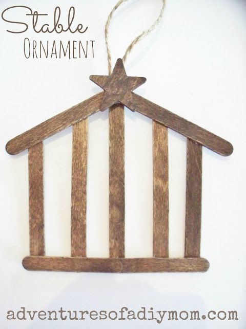 a wooden ornament with a star hanging from it